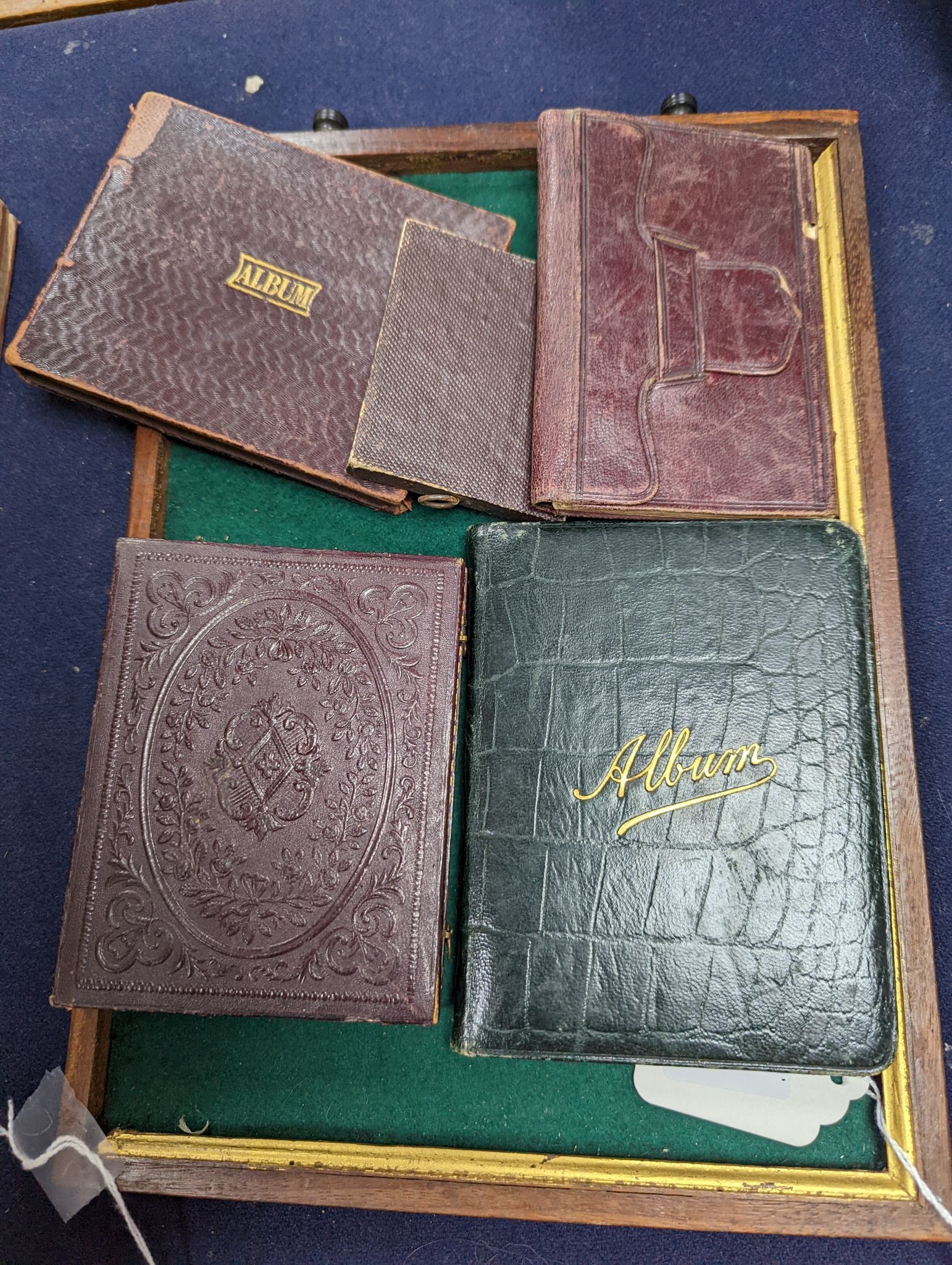 A 19th century cased Daguerreotype of a lady, six cased Ambrotype portraits and three 19th/20th century albums/diaries (two vacant). (10 items)